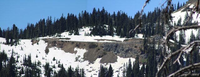 Snow still lingering near the summit ridge of Chinook Pass with the highway visible below